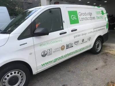 White Mercedes eVito van with Graduate Landscapes 100% Electric livery, front three-quarter view