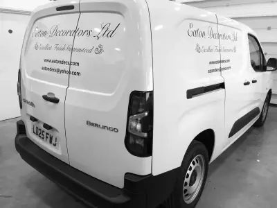 White Citroen Berlingo van with Eaton Decorators Ltd signwriting on rear and side doors