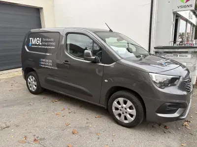Grey Vauxhall Combo van with TMGL The Moseley Group Limited graphics outside VSIGNS