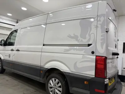 White VW Crafter van rear quarter with grey Lanzante elephant graphic wrap