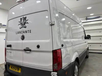 White VW Crafter van rear doors with black Lanzante elephant logo and wordmark
