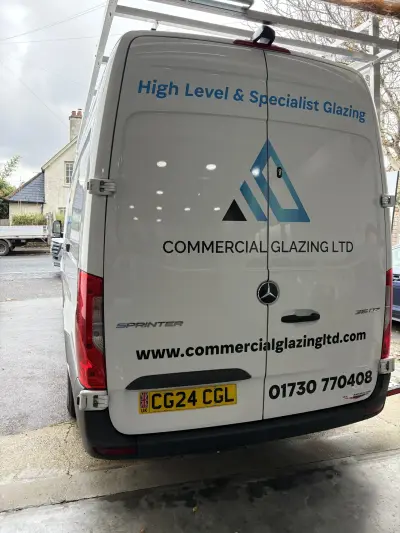 White Mercedes Sprinter van rear with Commercial Glazing Ltd High Level Specialist Glazing graphics