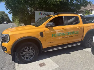Orange Ford Ranger Wildtrak pickup side with green Fordingbridge inspiring design and build graphics