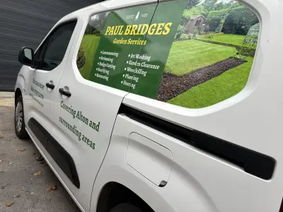 White Peugeot van window graphics for Paul Bridges Garden Services listing lawnmowing and hedge cutting