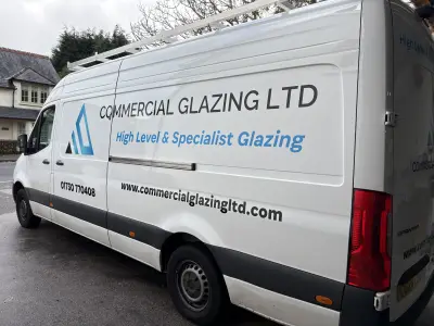 White Mercedes Sprinter van with Commercial Glazing Ltd side signwriting and roof ladder