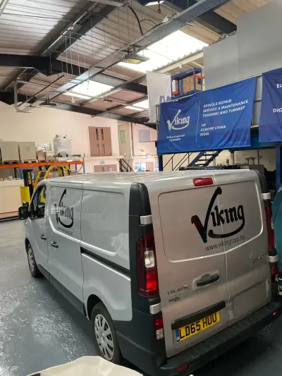 Silver Renault Trafic van with black Viking logo signwriting, parked inside a warehouse