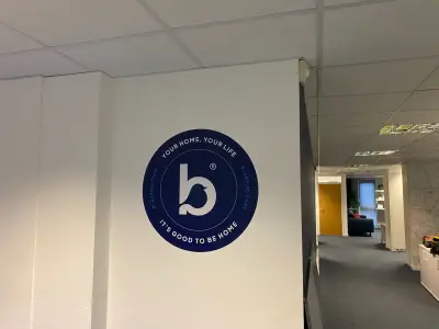 Gym wall with large blue Team Churchers lettering above a row of treadmills