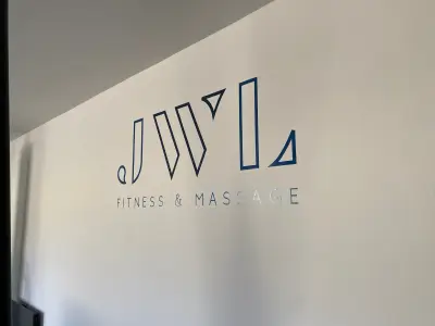 Wall vinyl with blue JWL Fitness & Massage logo