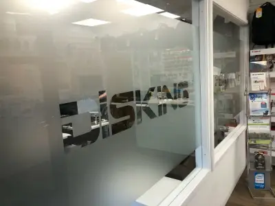 Shop window with frosted 'Disking' etched-glass vinyl graphic
