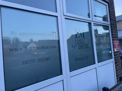 Lisle Medical frosted window graphics with logo and contact details on shopfront