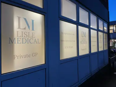 Lisle Medical Private GP frosted window graphics lit at dusk on Row House
