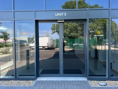 Grey glazed unit frontage with MSL Global window graphics and UNIT 3 fascia lettering