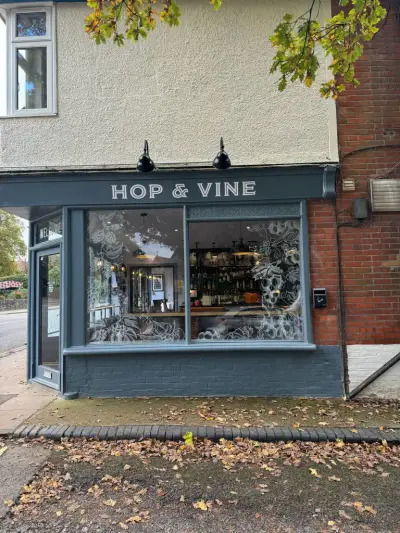 Hop & Vine bar frontage with fascia sign and frosted hop and grape window graphics