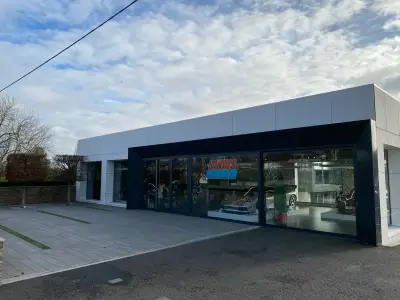 McLaren Petersfield showroom exterior with Santa's Carwash festive bubble window graphics