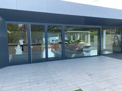 McLaren Petersfield showroom with Halloween blood-splatter, Scream mask and Do You Like Scary Movies graphics