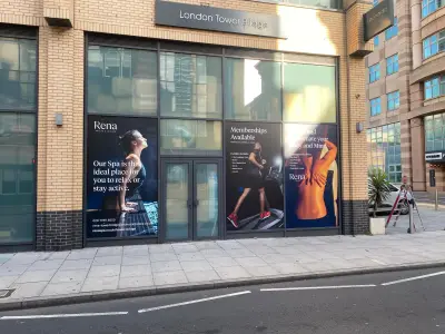 Rena spa window graphics below the London Tower Bridge hotel fascia sign
