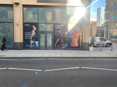 Rena Health & Leisure printed window graphics on a hotel frontage in low sun