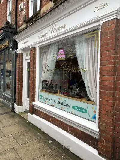 Sweet Heaven bakery frontage with Sewing & Alterations Petersfield window graphics