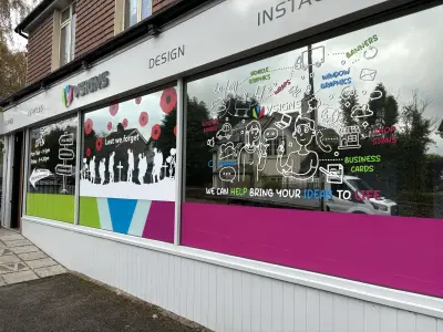 VSigns shopfront with Lest We Forget Remembrance window graphics of poppies and soldiers